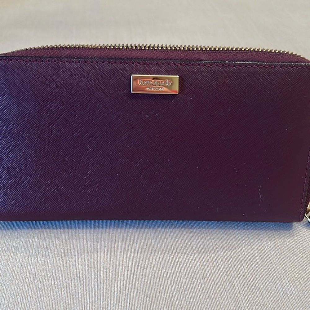Gently used Kate Spade zip around wallet.